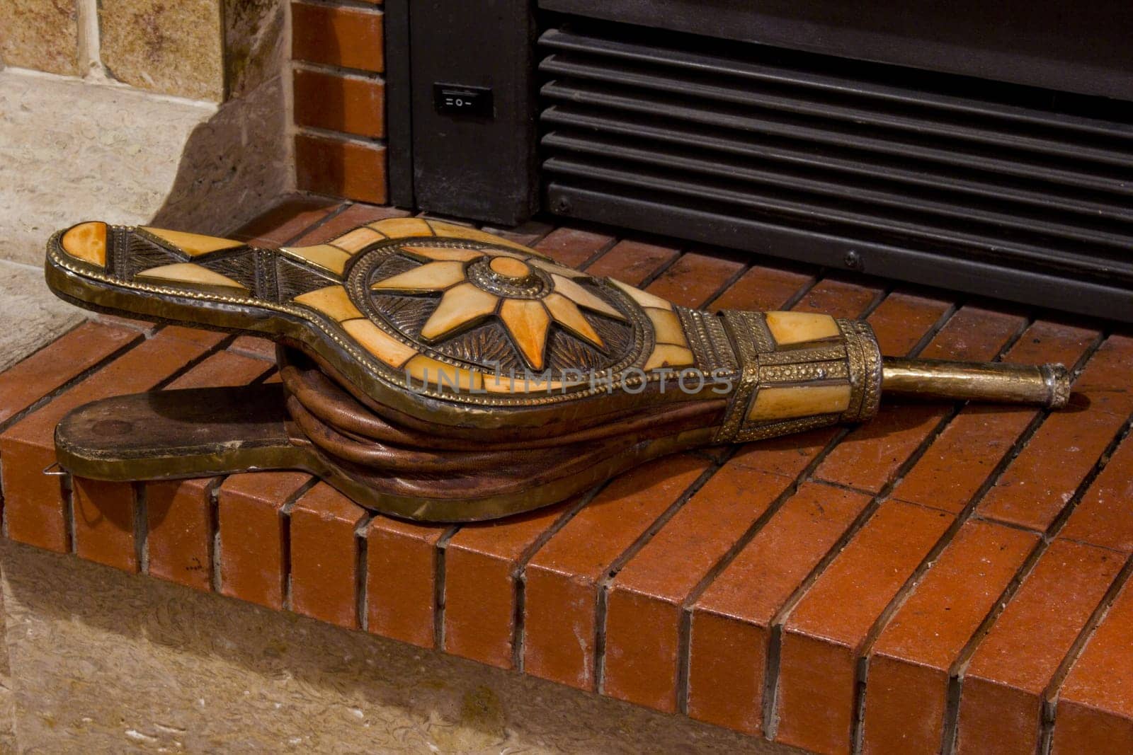 Fire place detail of a fire burning inside.