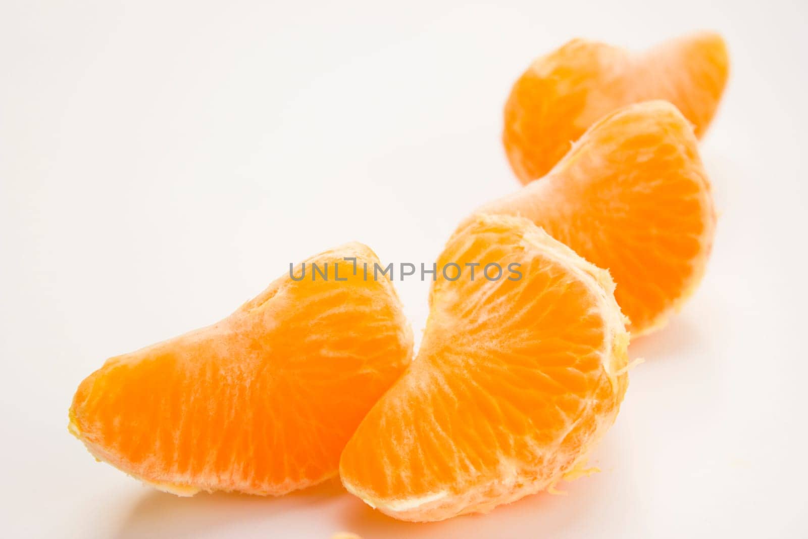 Vibrant mandarin fruit on a white background.