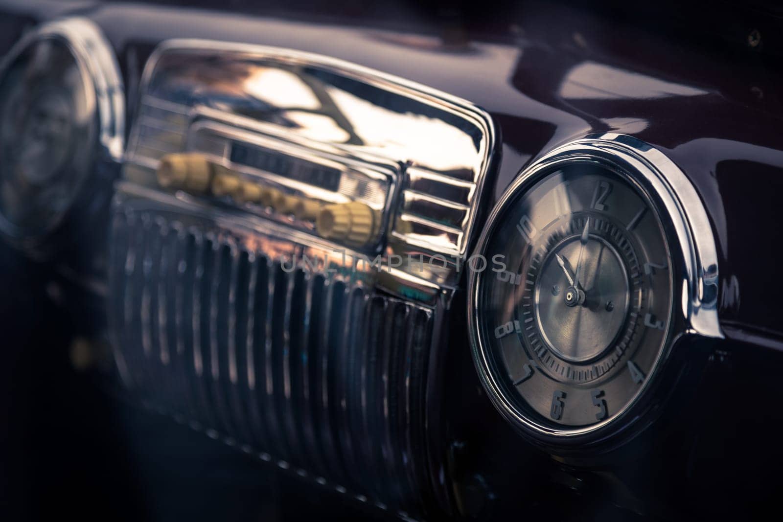 Clock in retro interior of old automobile