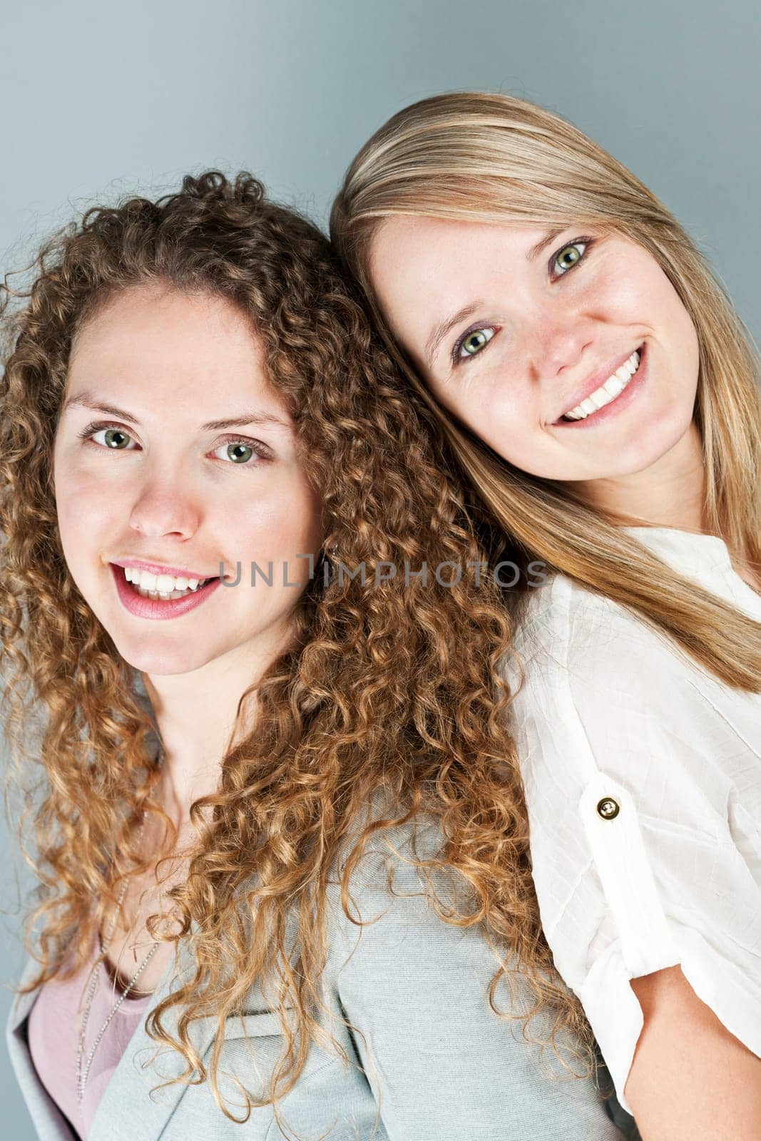 Portrait of two pretty caucasian young women