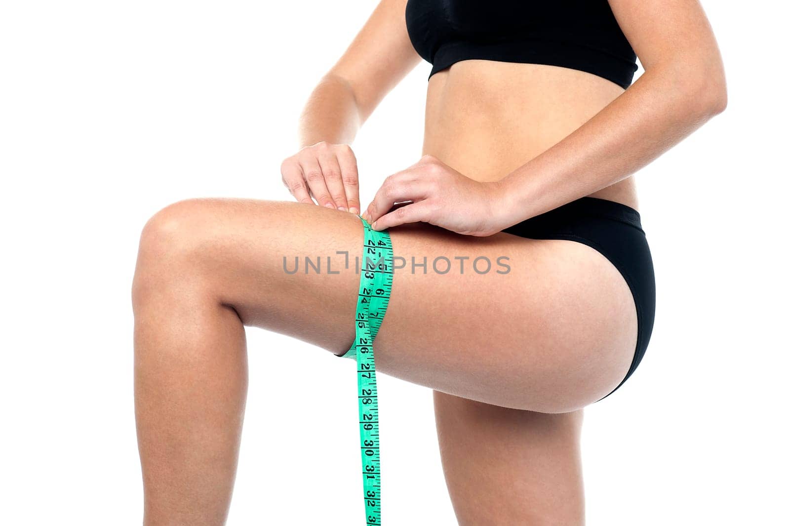 Woman measuring her perfect body. Healthy lifestyle concept