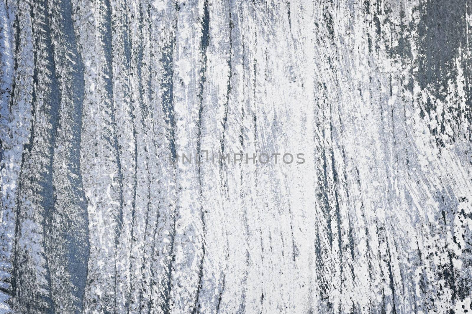 Textured background of distressed rustic wood with peeling blue and white paint