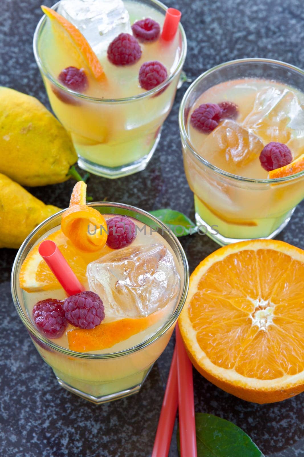 Lemonade in glazes of fresh lemons,oranges and raspberries with ice cream