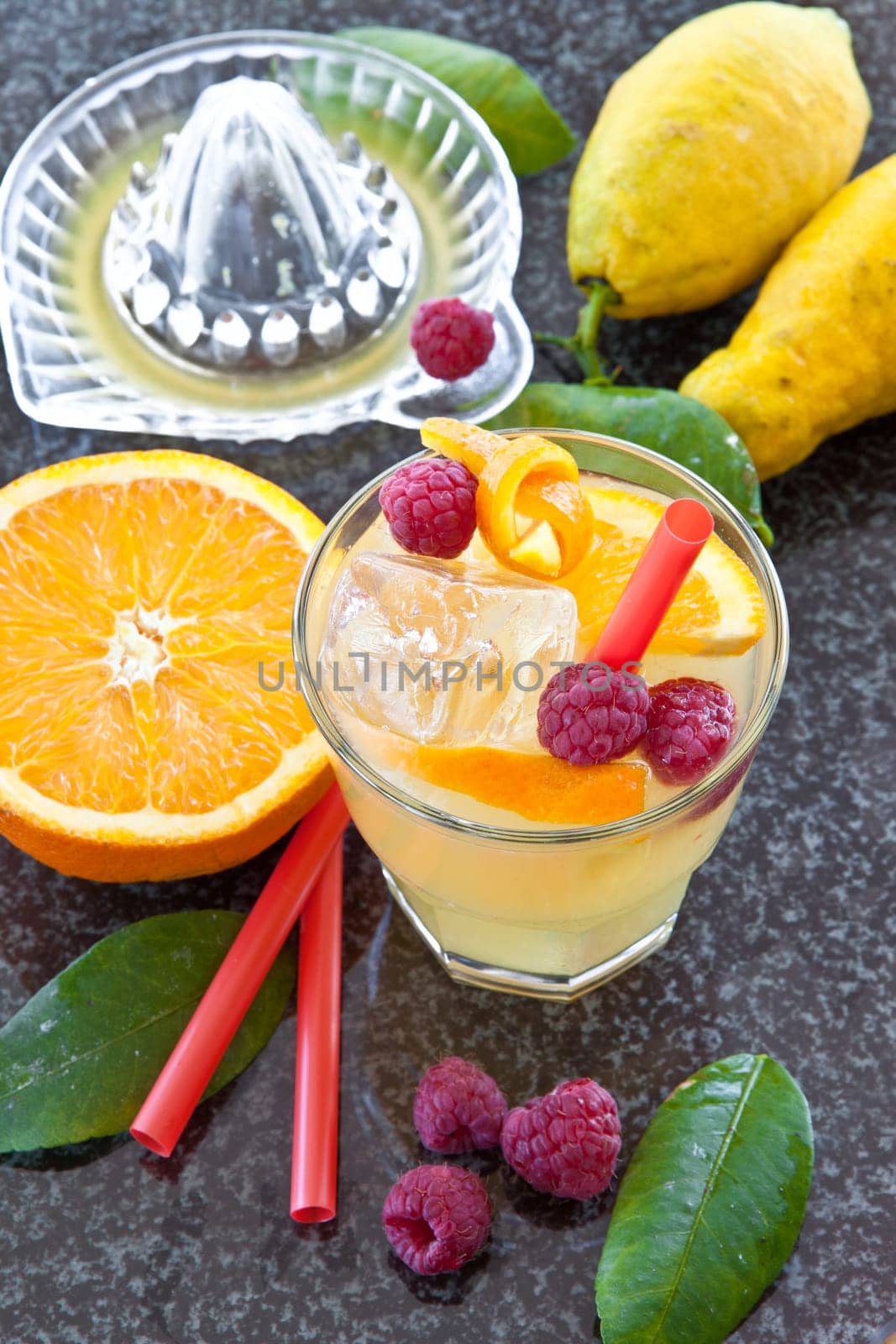 Lemonade in glazes of fresh lemons and oranges with ice cream