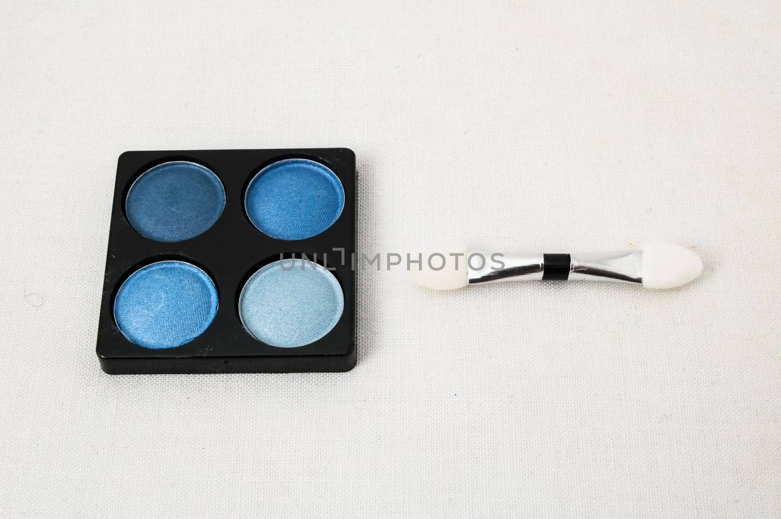 Make-up Palette Of Colorfully Eyeshadows Over White Background