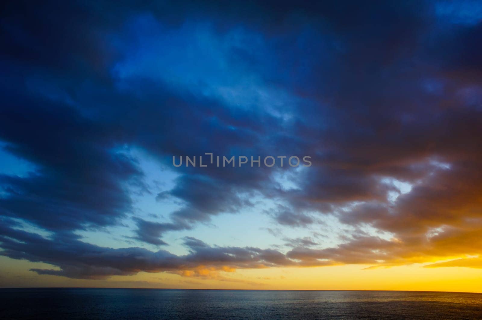 Cloudscape, Colored Clouds at Sunset near the Ocean
