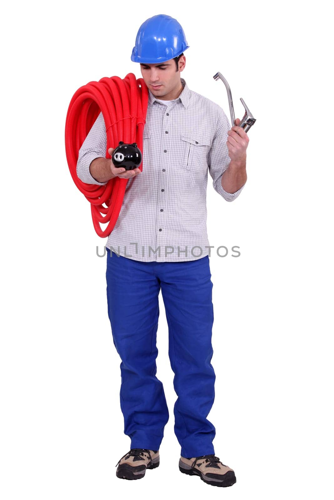 Plumber holding piggy-bank and tap