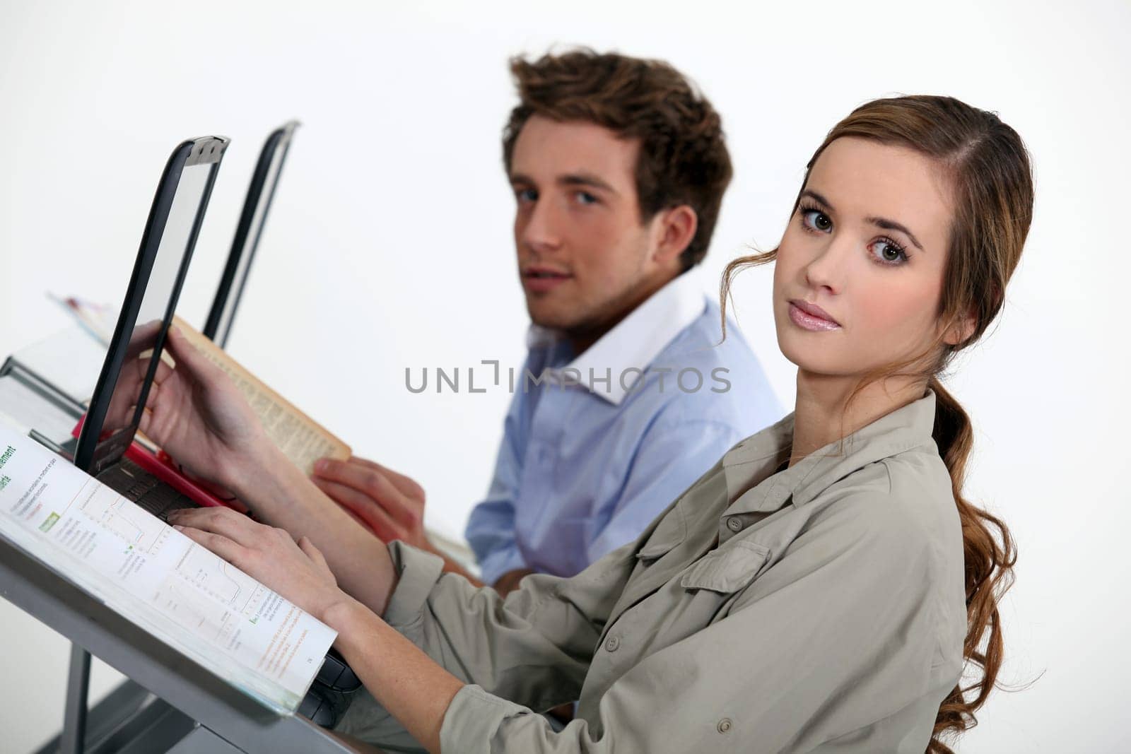 Smart young people using laptop computers