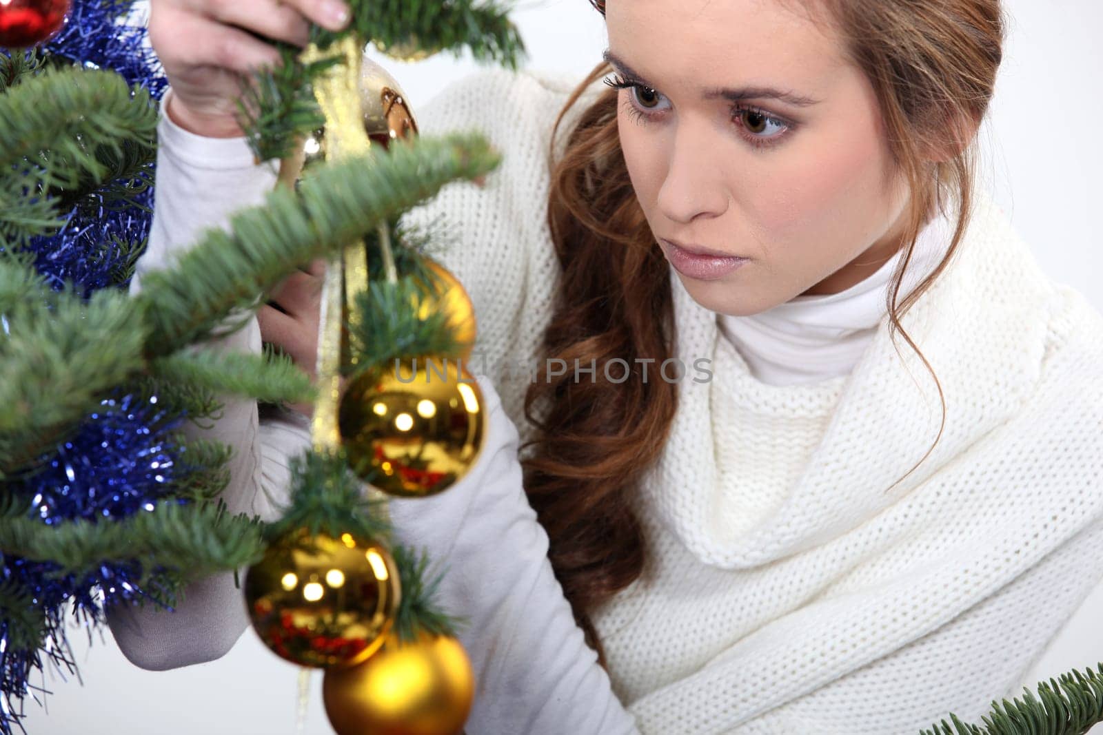 pretty damsel watching Christmas decoration