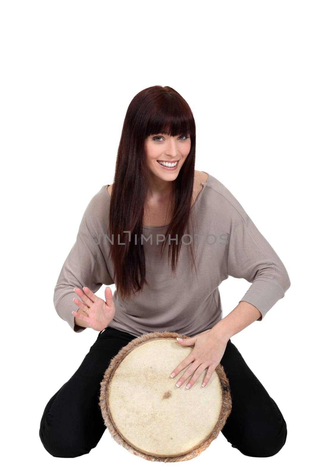 Woman banging a bongo