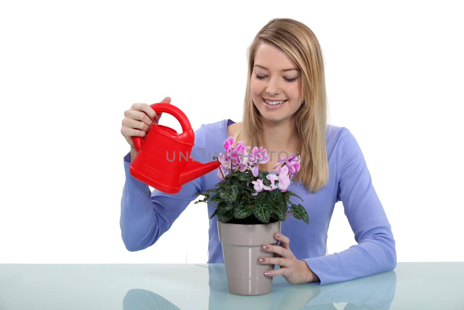 Woman watering plant