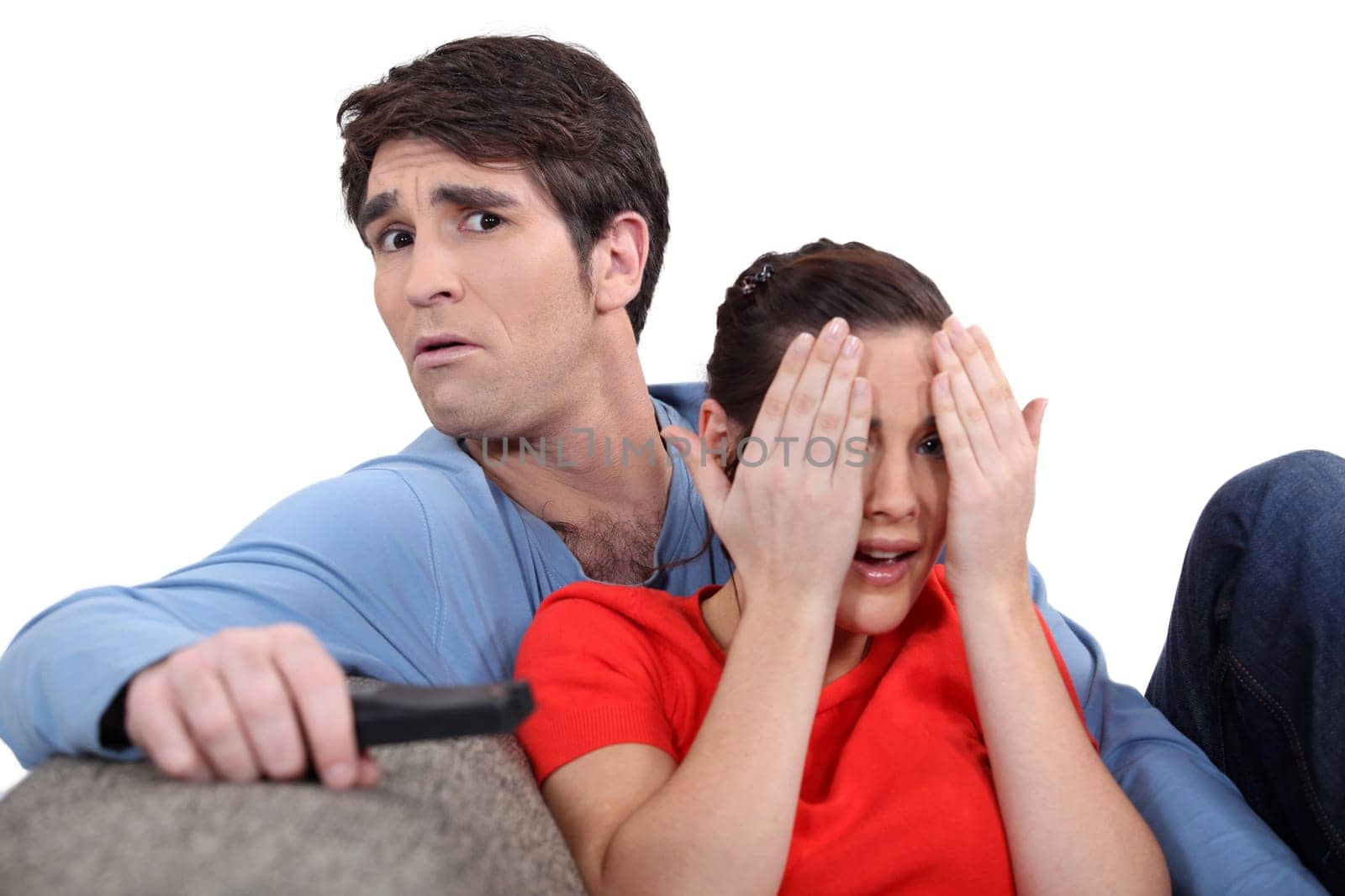 Couple watching a scary film