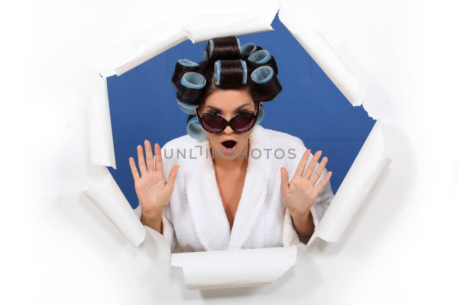 woman wearing sunglasses with hair curlers