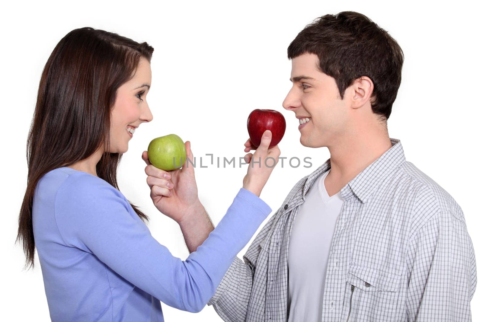Couple exchanging apples