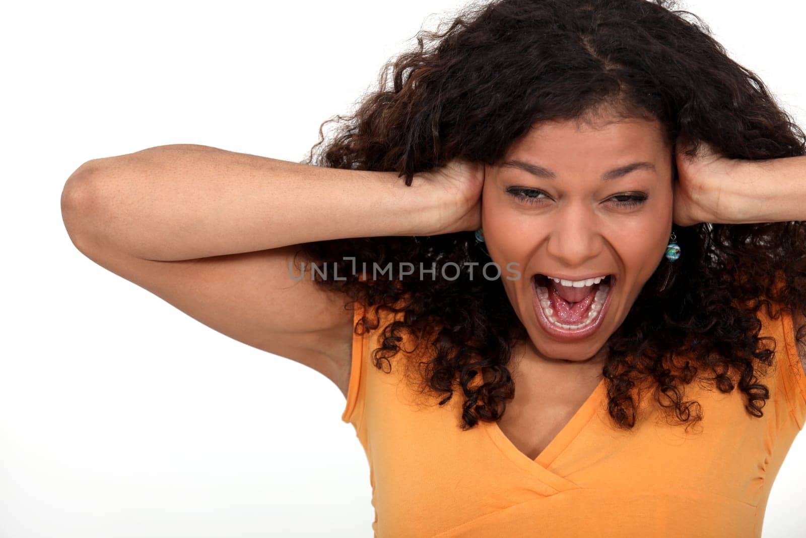 Woman covering her ears