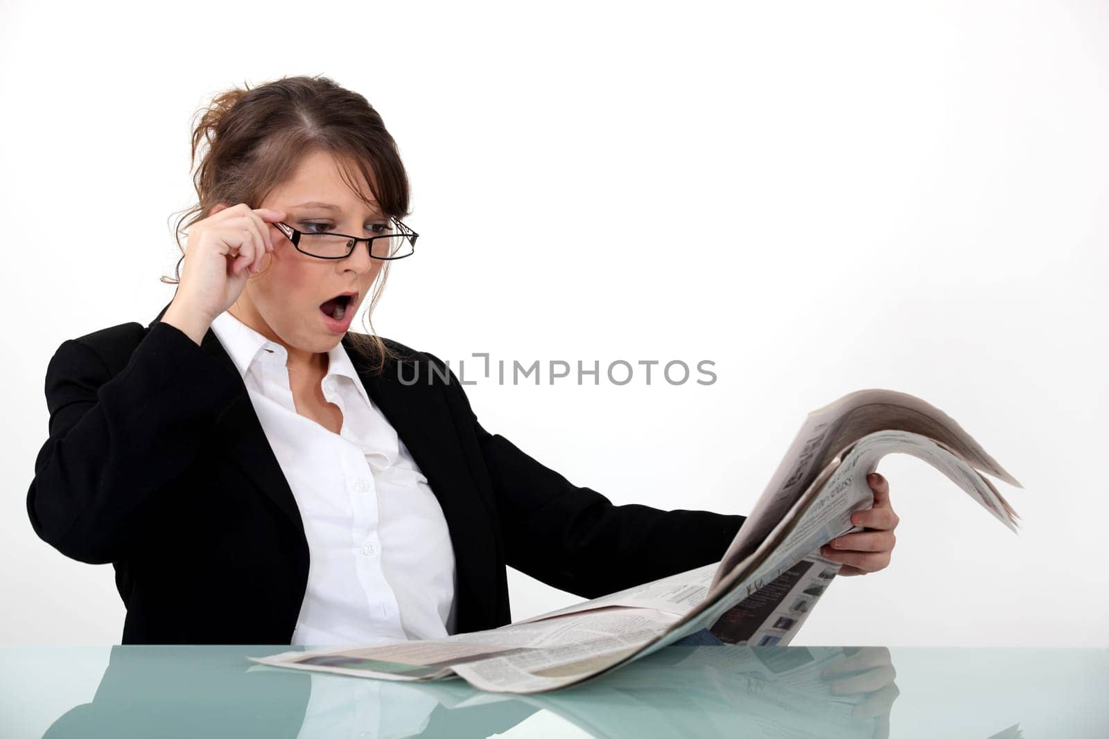 Businesswoman shocked at her newspaper