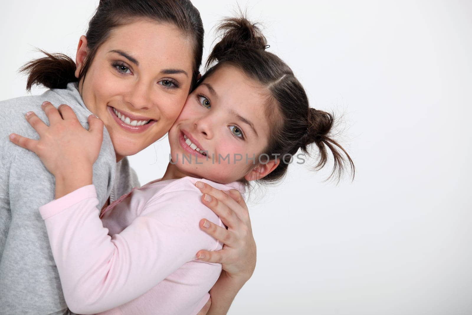 Mother hugging her daughter