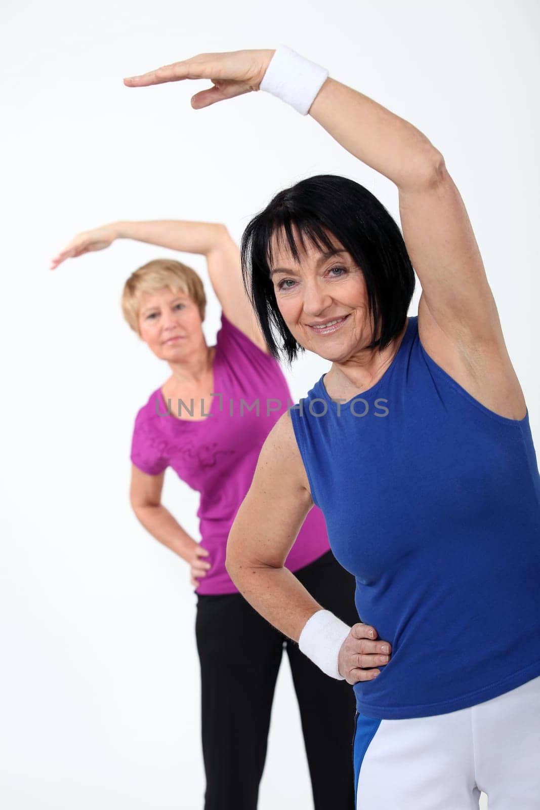 two senior women doing fitness