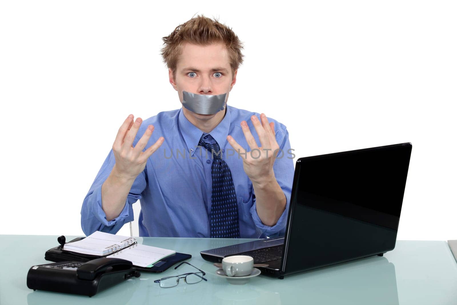 Office worker with his mouth taped shut