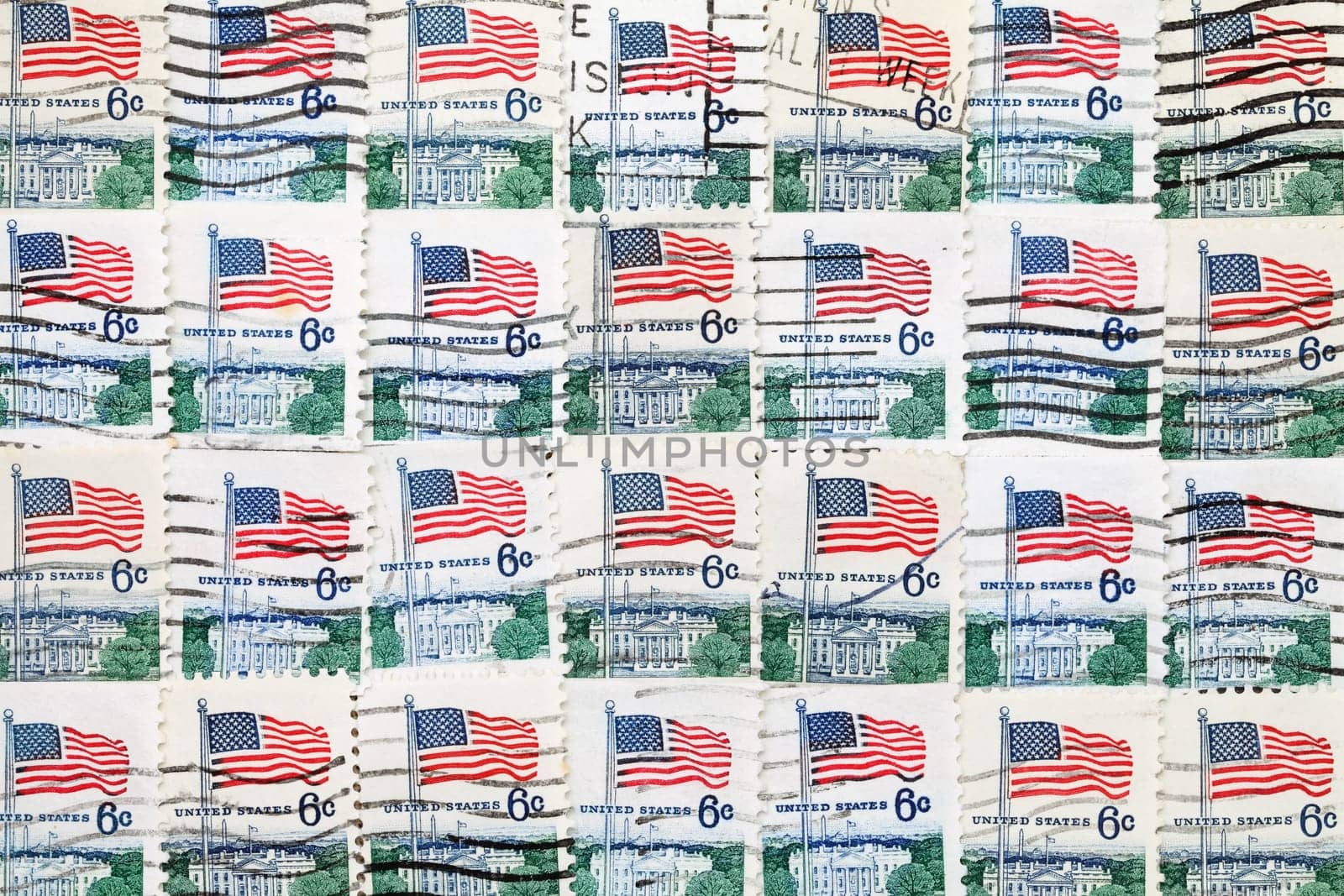 background of used US postage stamps