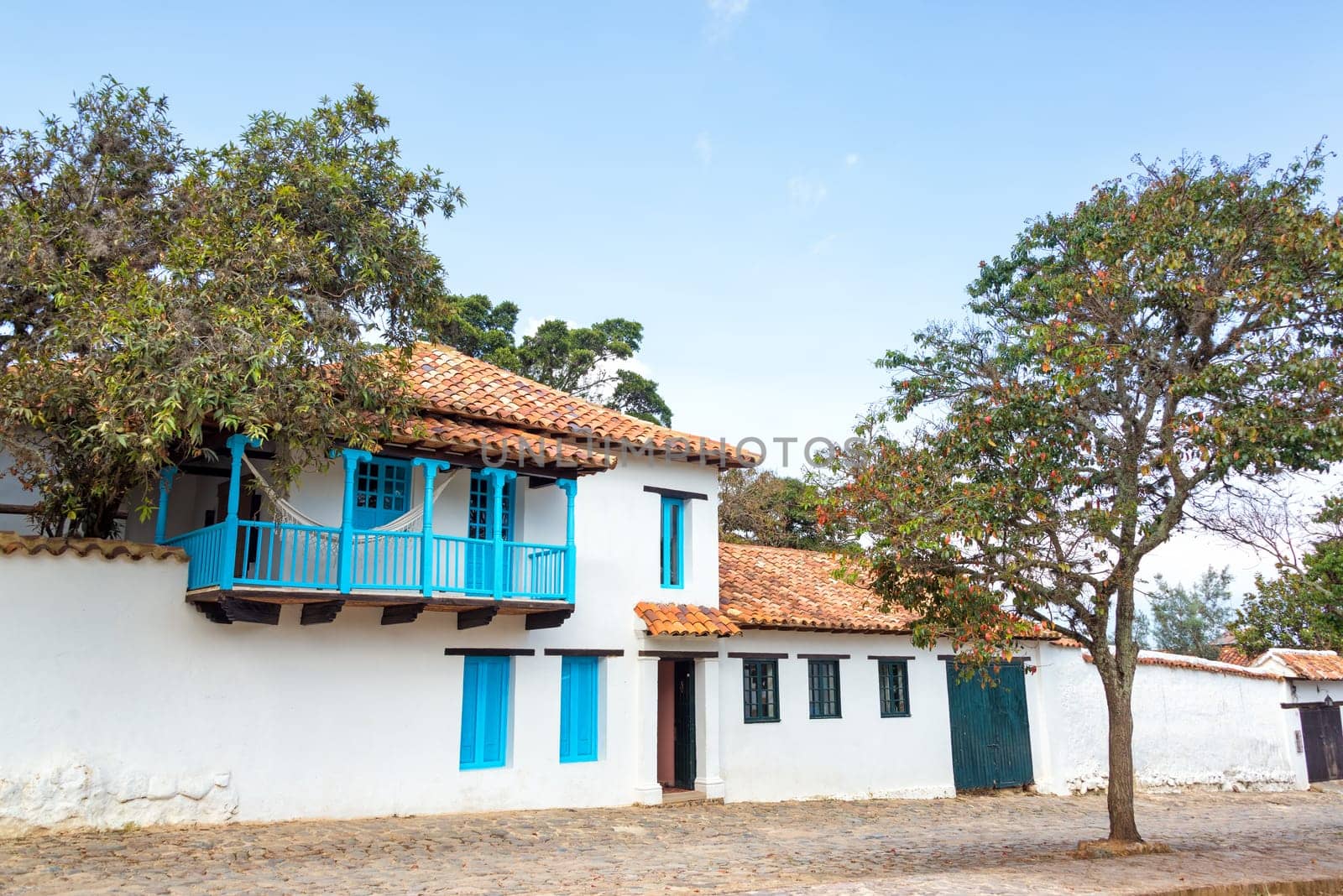 White colonial architecture with a light blue balcony in Villa de Leyva in Boyaca department in Colombia