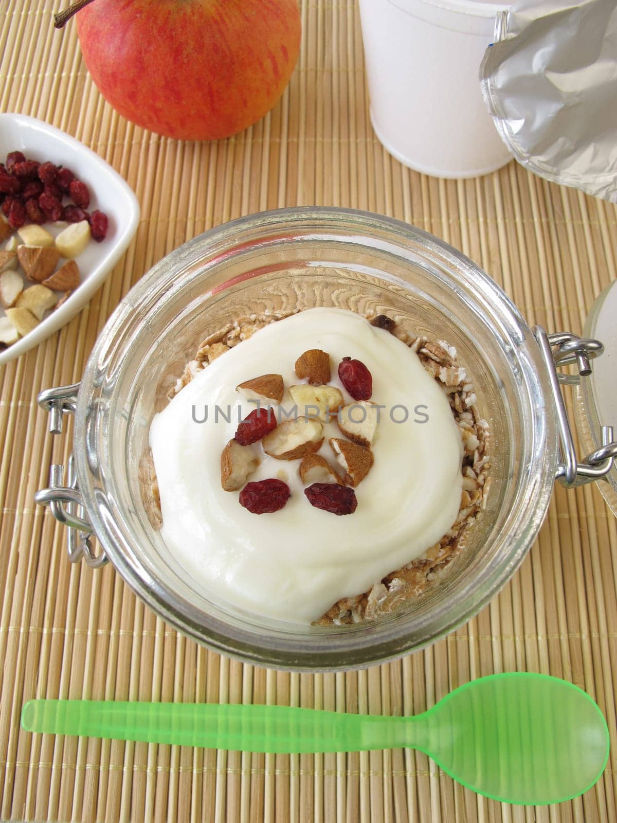 Shake muesli with yoghurt in the glass