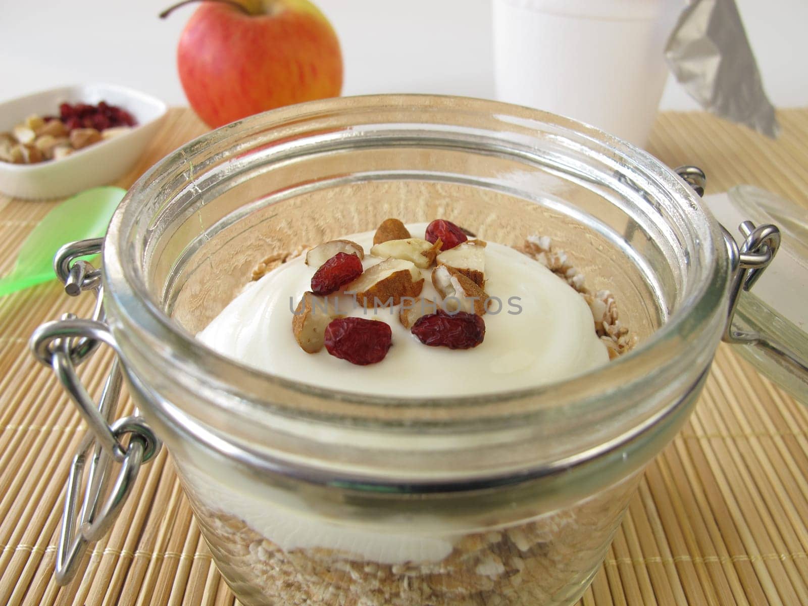Shake muesli with yoghurt in the glass