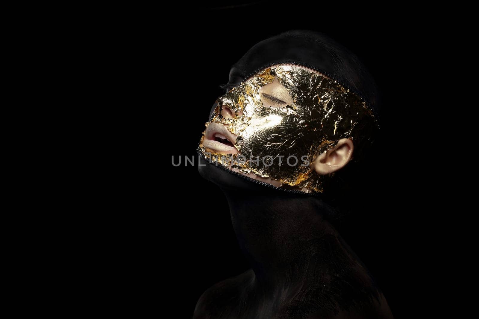 Fiction. Imagination. Futuristic Creature in Crazy Mystic Mask and Gilt