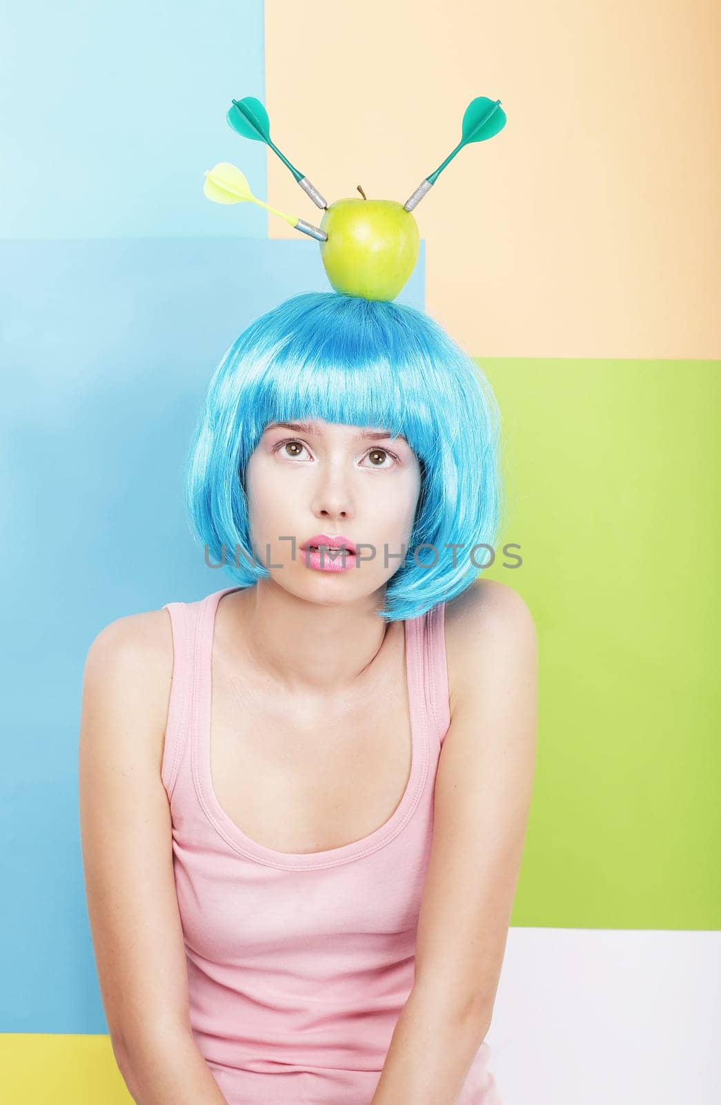 Stylized Woman with Apple on her Blue Haired Head. Series of Photos