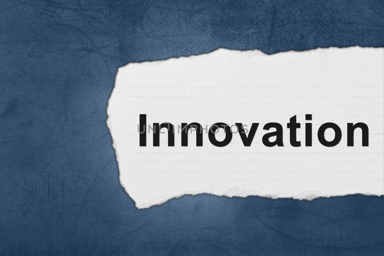 Innovation with white paper tears on blue texture