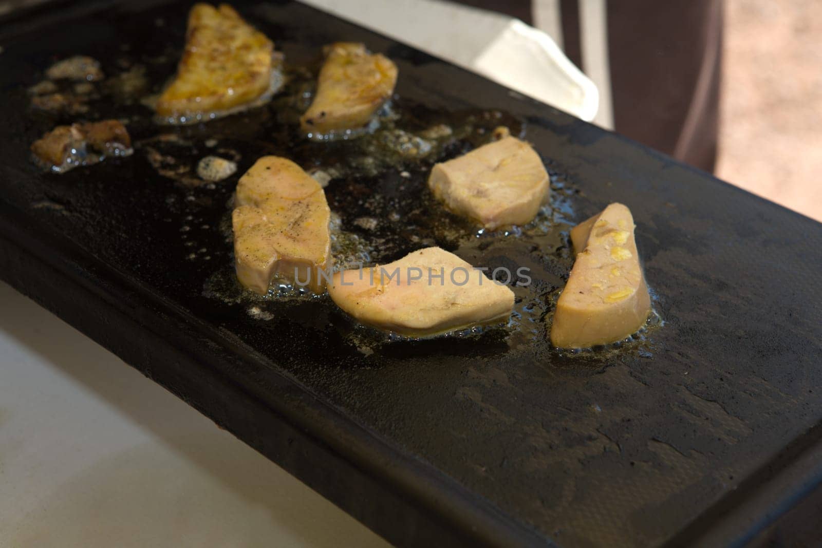 Close up frying foie gras on the griddle