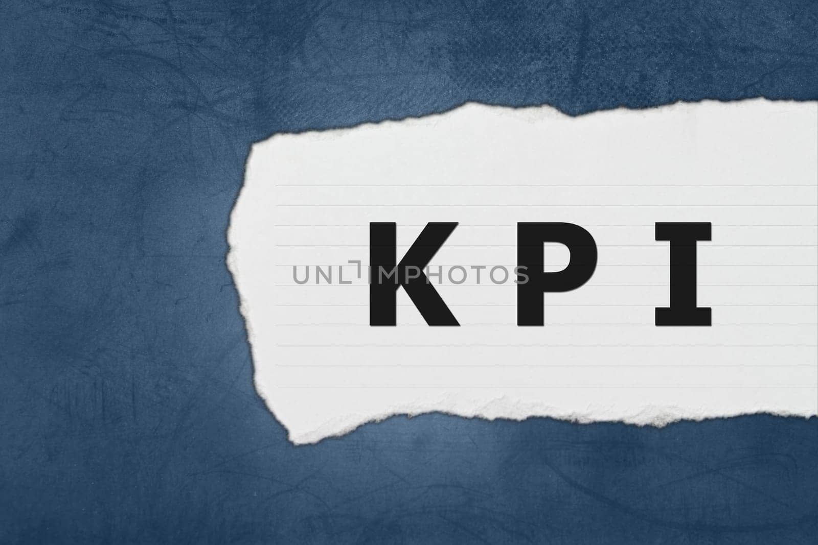 KPI or Key Performance indicator with white paper tears on blue texture