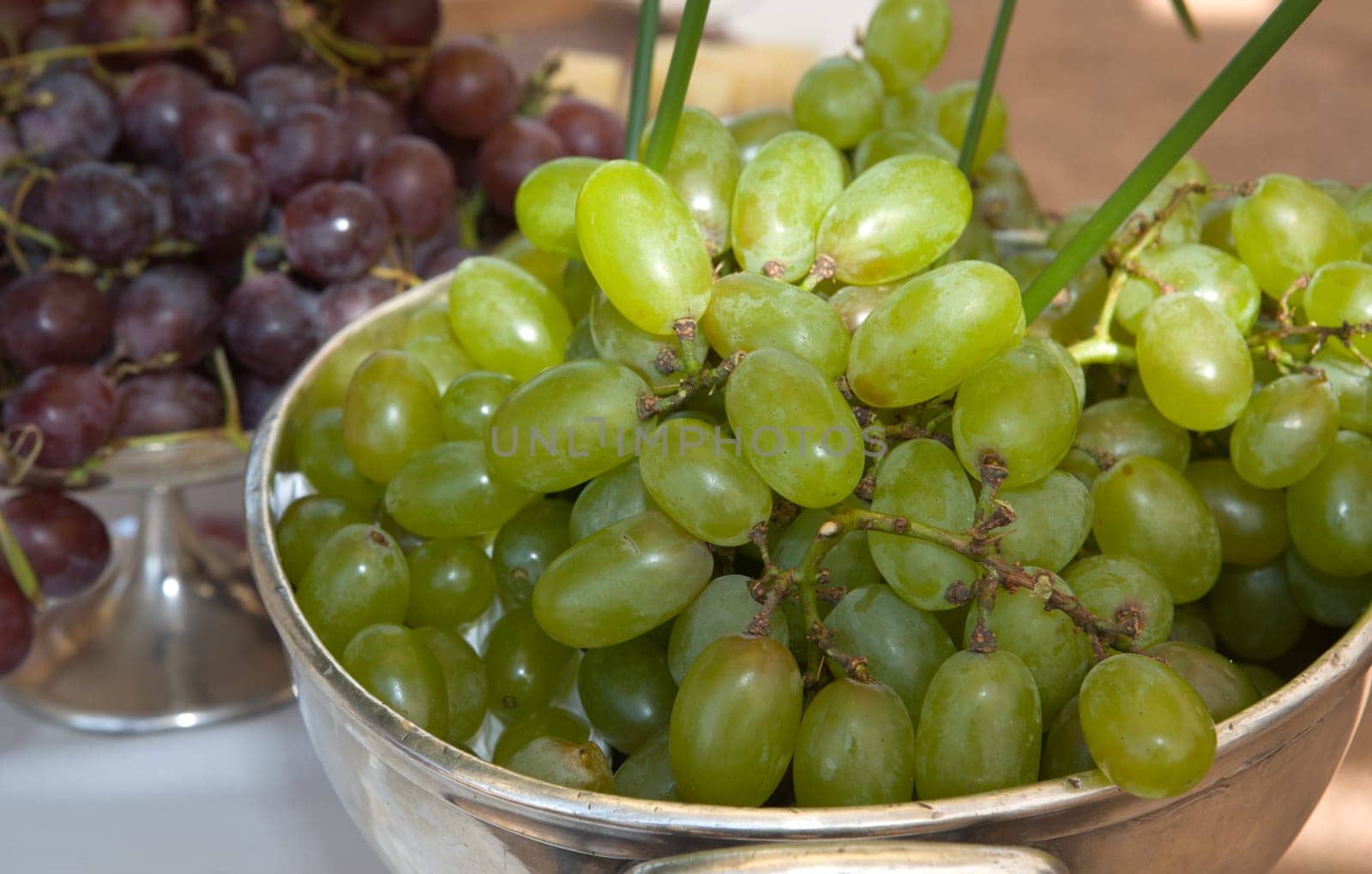 Two kind of grapes, white and red, over a silver bowl, Cordoba, Spain
