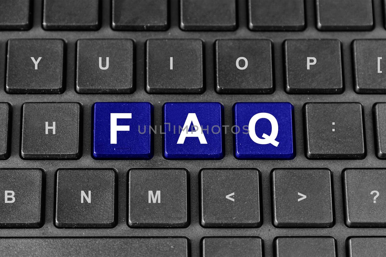 FAQ or Frequently asked questions blue word on keyboard