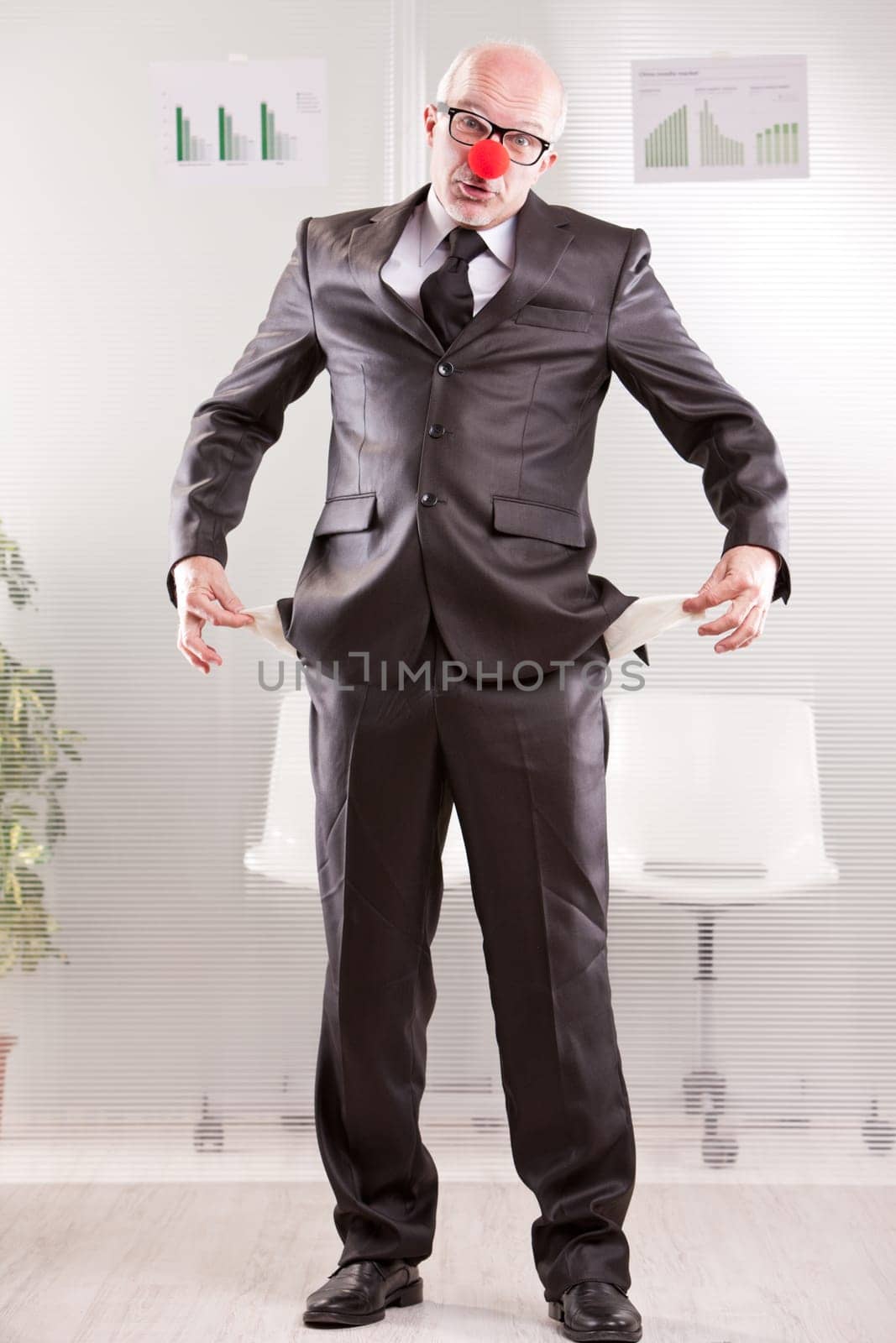 clowny businessman pretending he hasn't money to pay back