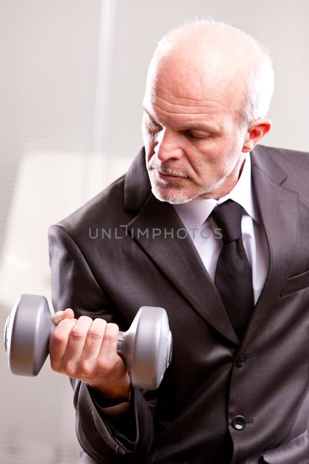 weightlifting business man in action looking at his shot