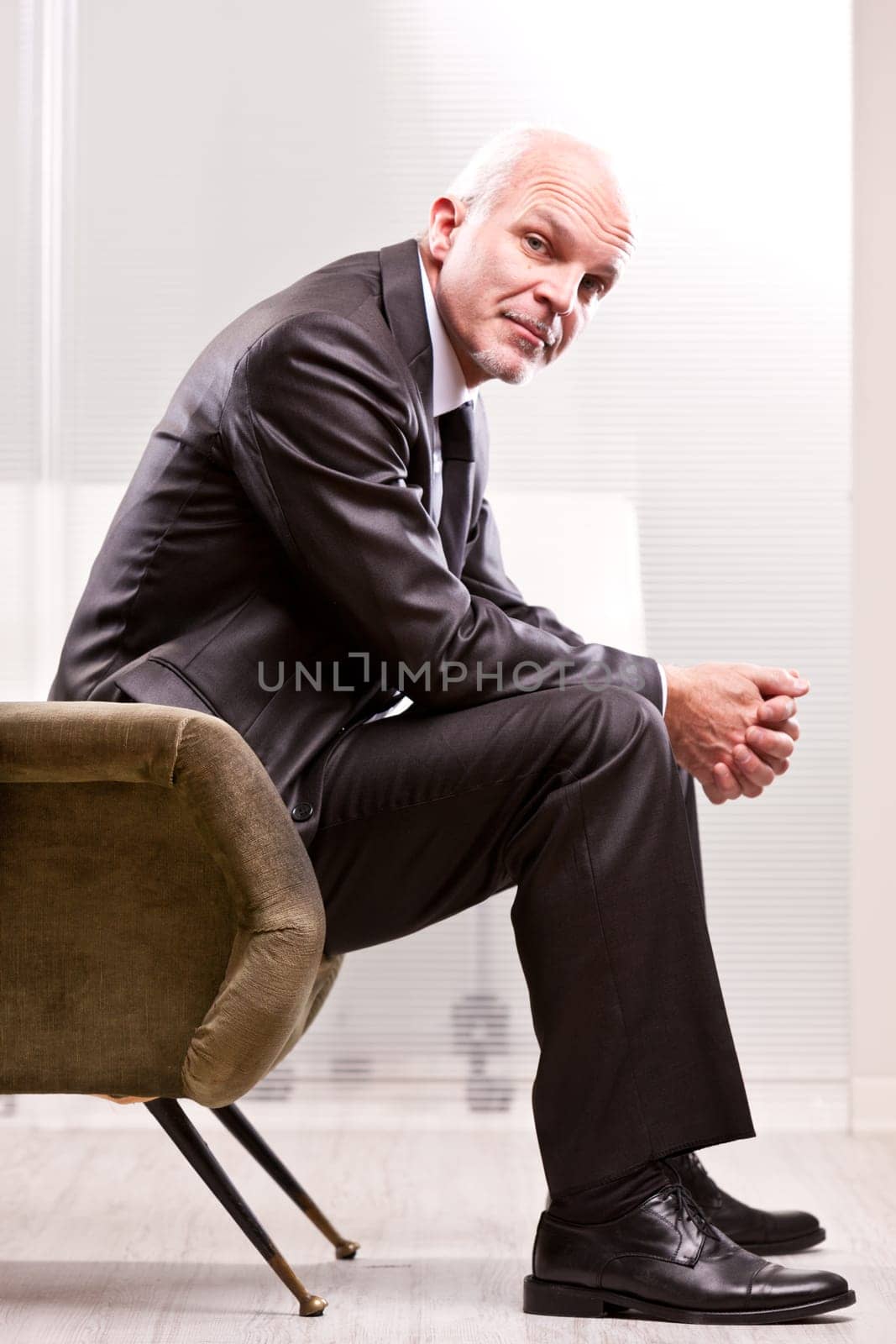 mature businessman looking at you with a strong empathy