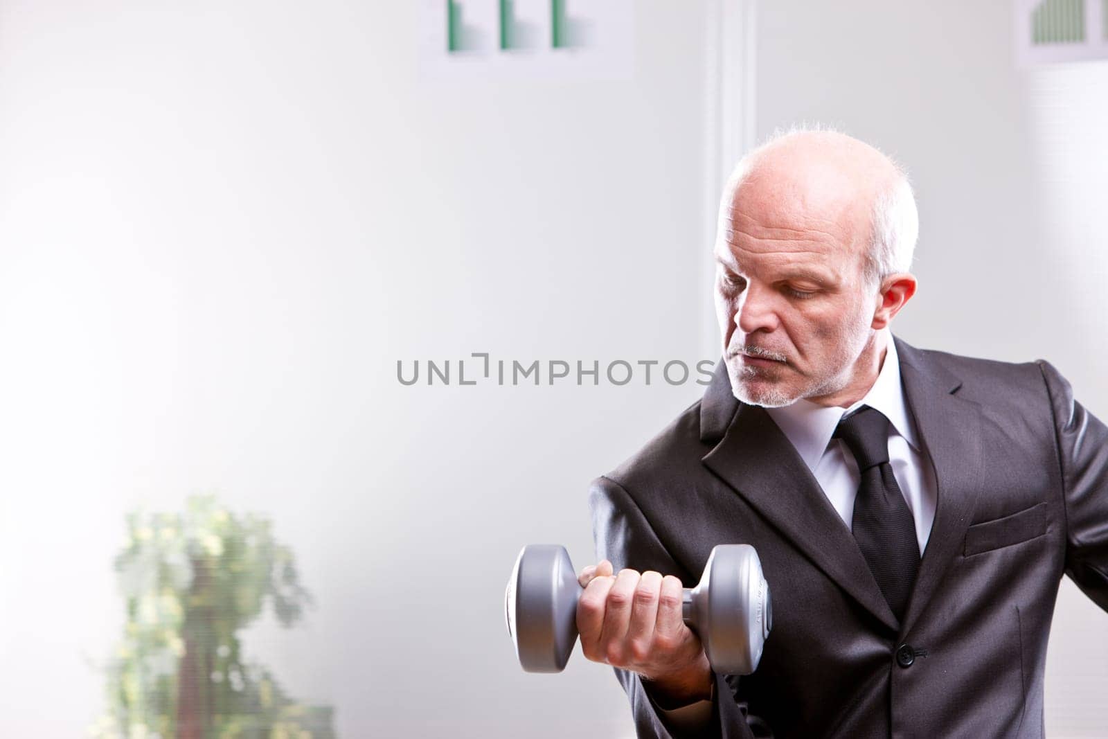 weightlifting business man in action looking at his shot