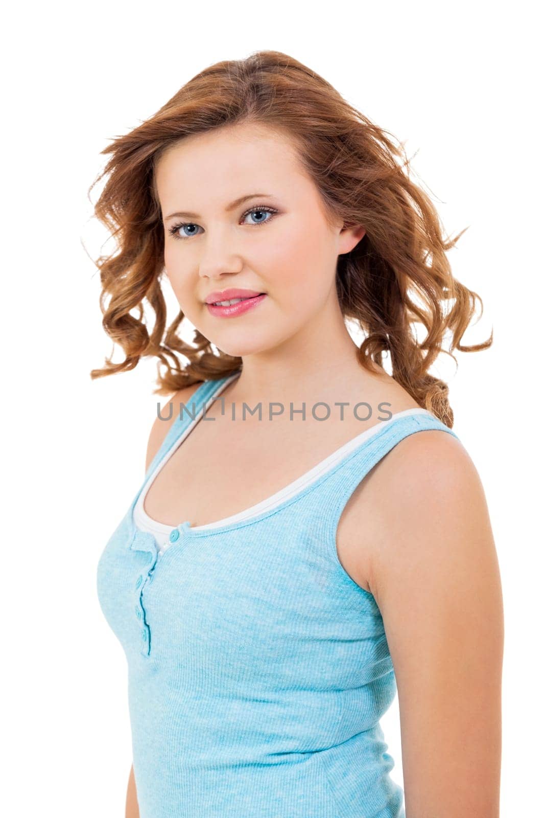 Blonde girl teen with blue eyes and blue shirt laughing portrait isolated