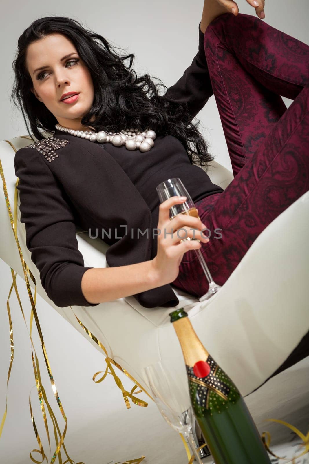 elegant attractive young woman with champagne and air snakes party outfit fashion celebration