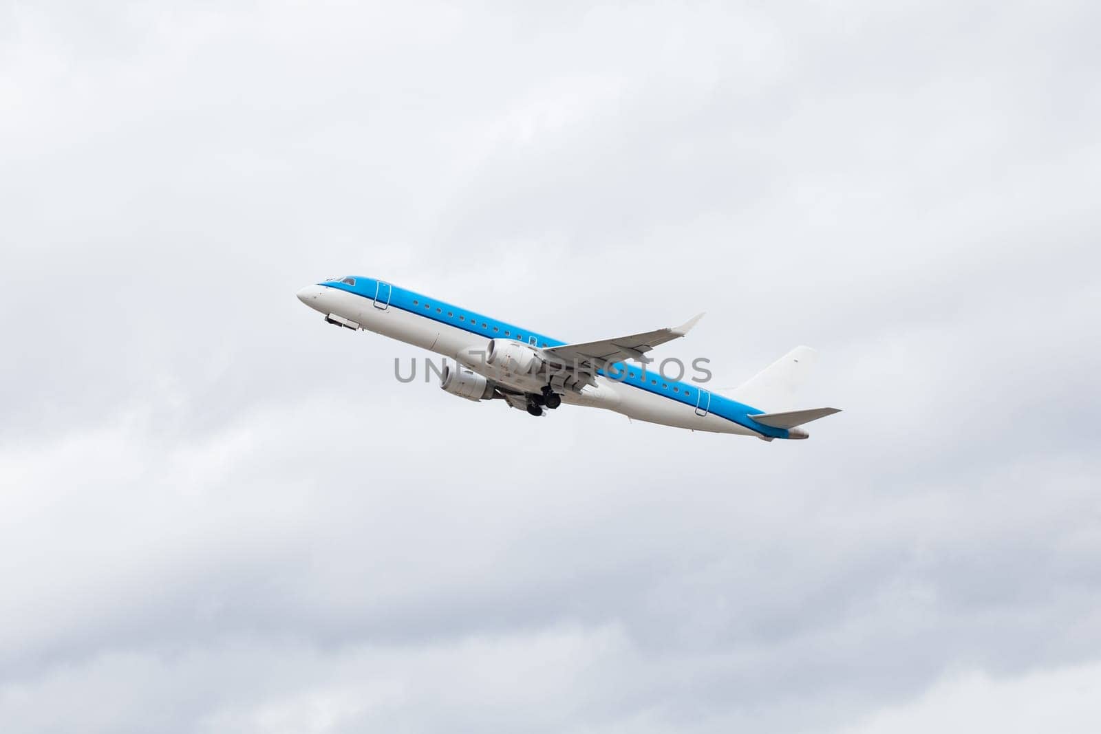 large passenger plane in the air before blue sky holiday travel transport