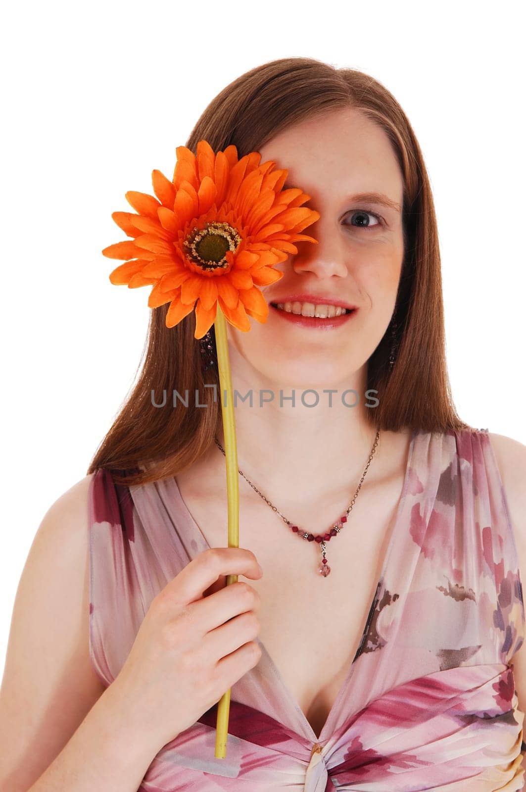 A closeup picture of a young woman holding a daisy for one eye.for white background..