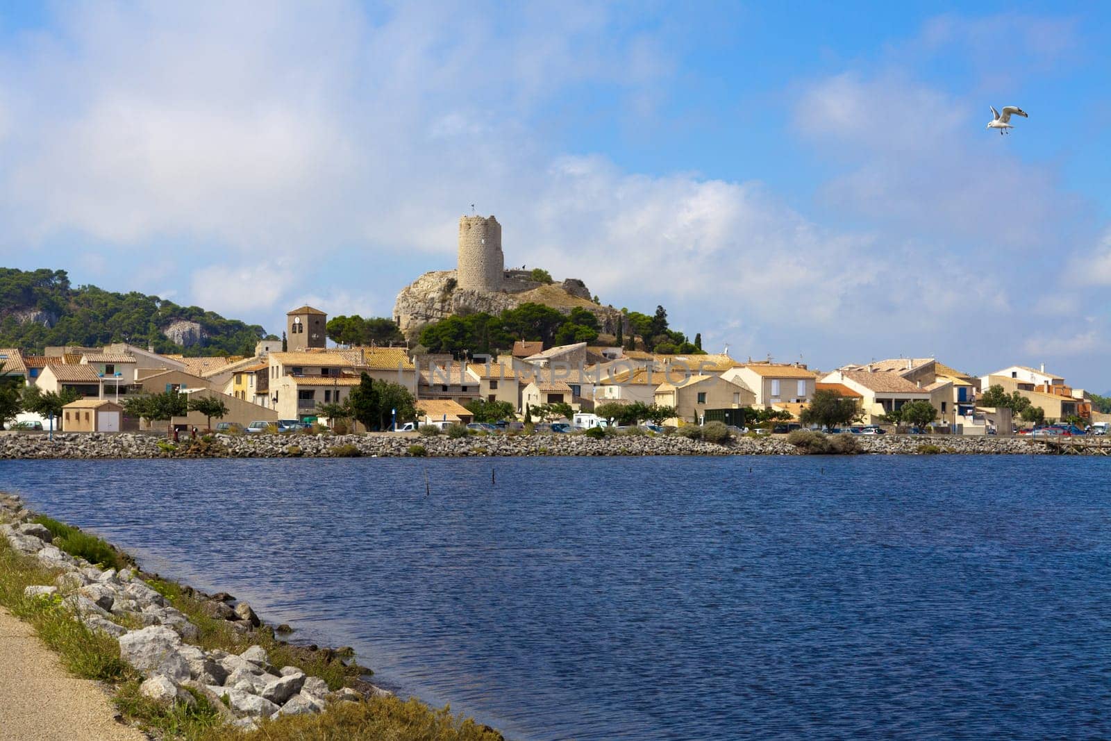 View on the little medieval village Gruissan with its castle ruins in the center