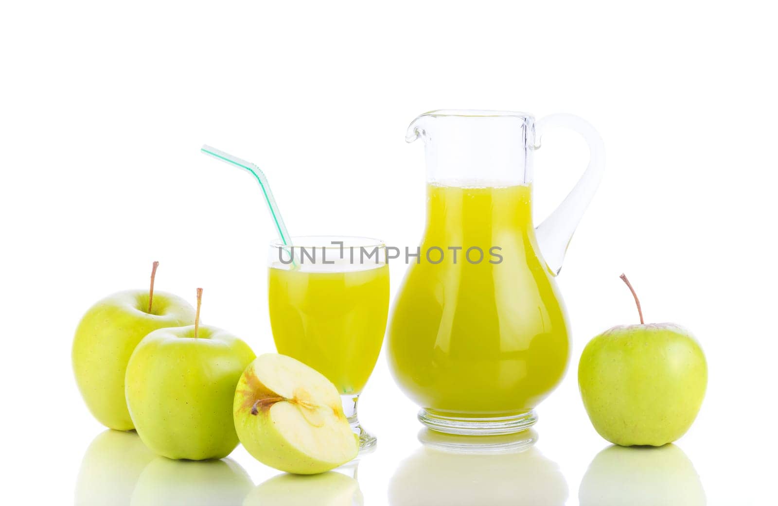 Juicing background. Fresh apples, glass with juice and carafe on white background. Healthy fruit eating and drinking..