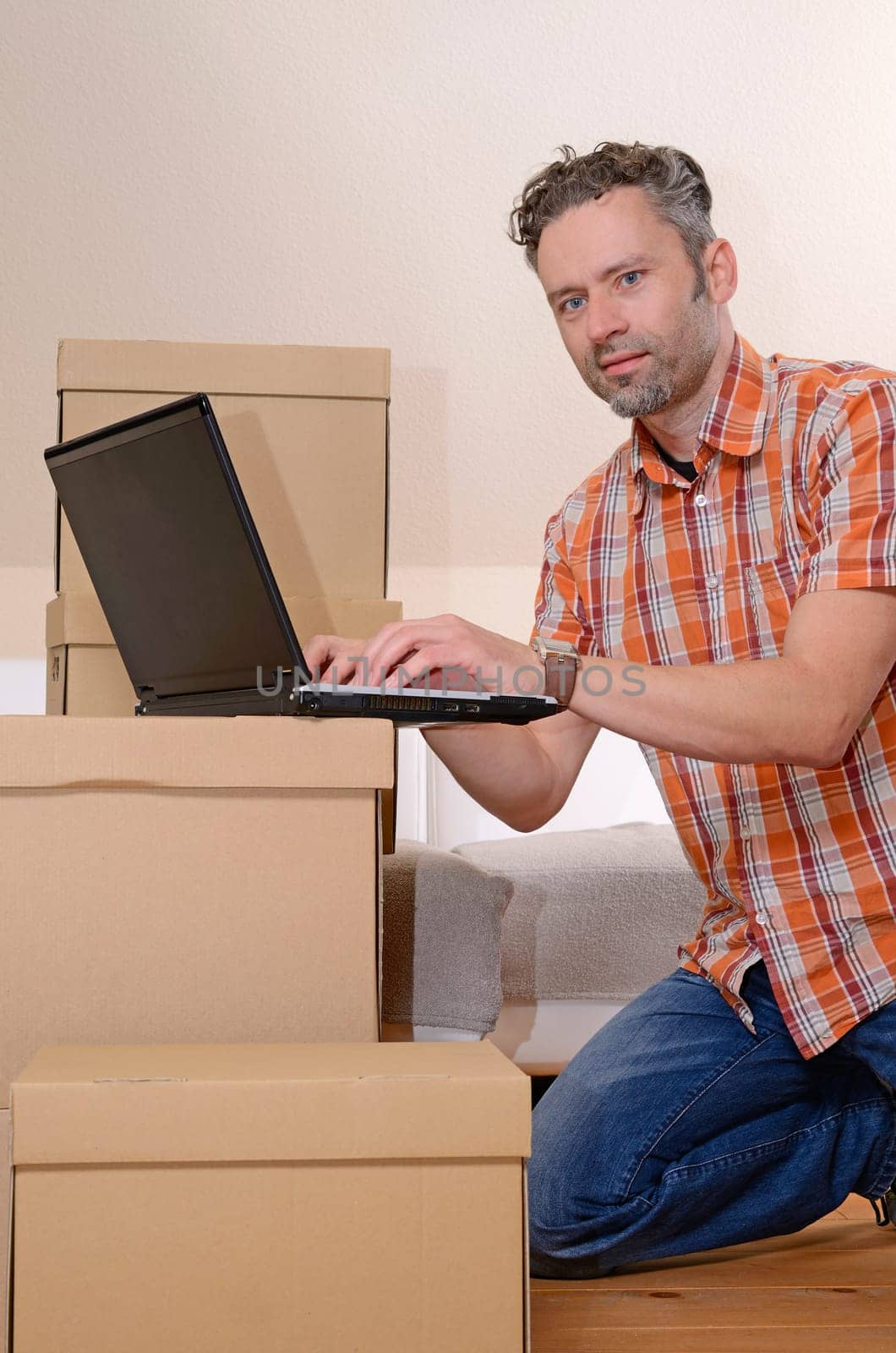 Happy man moving in new home