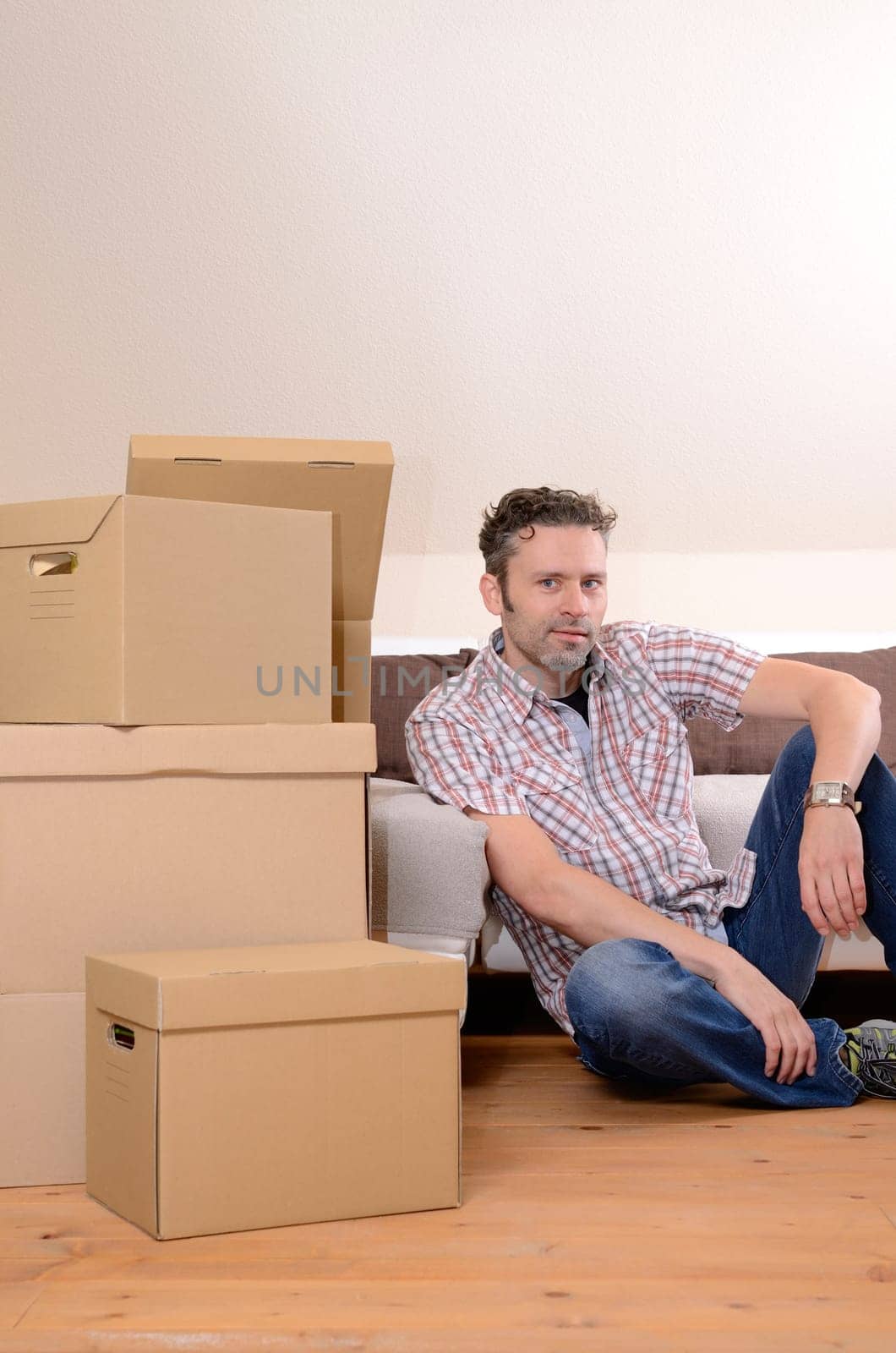 Happy man moving in new home