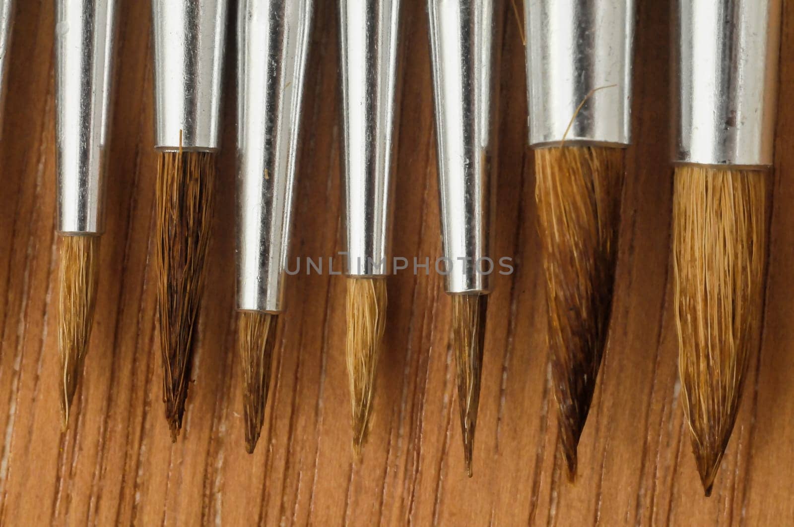 New Wooden Different Paintbrush Set Texture over a Colored Background