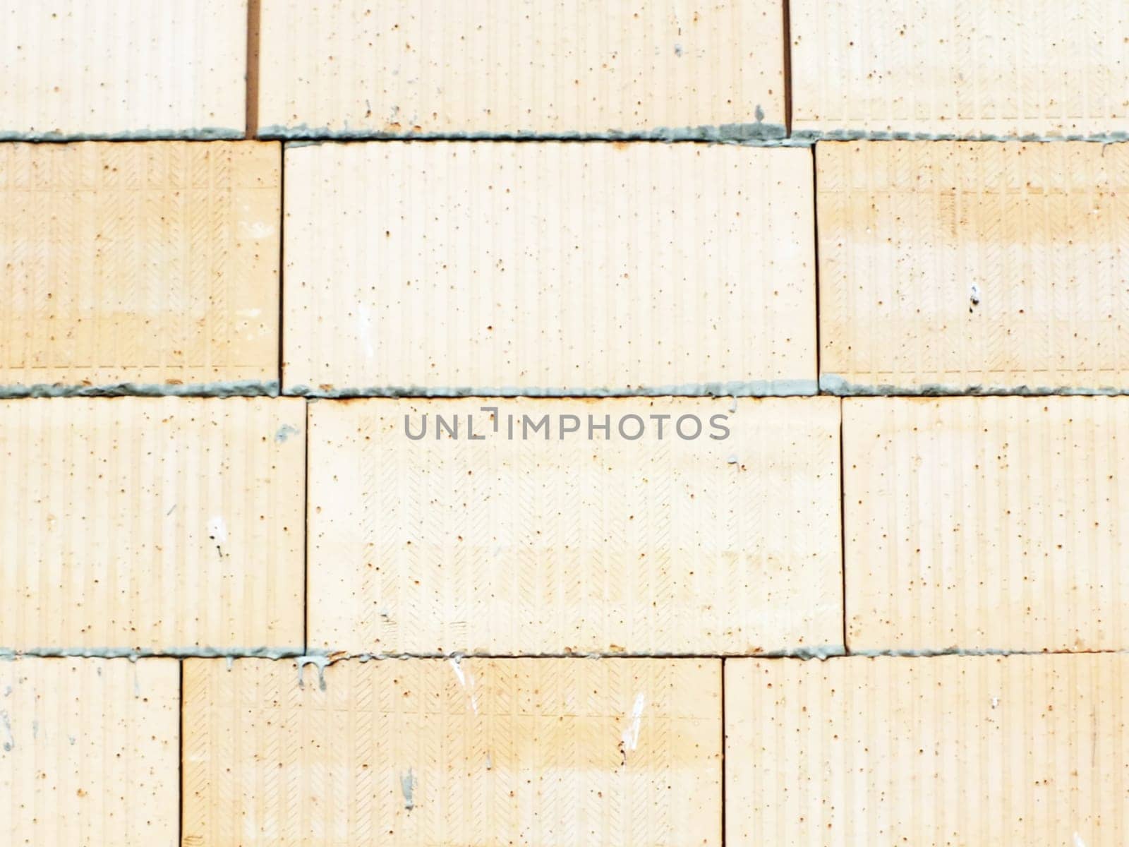 wall of small bricks stones as a background