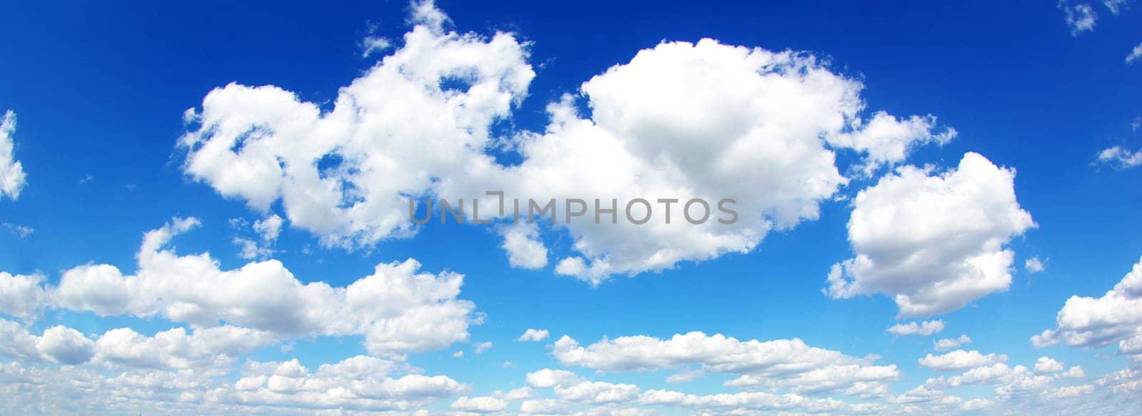 blue sky background with tiny clouds