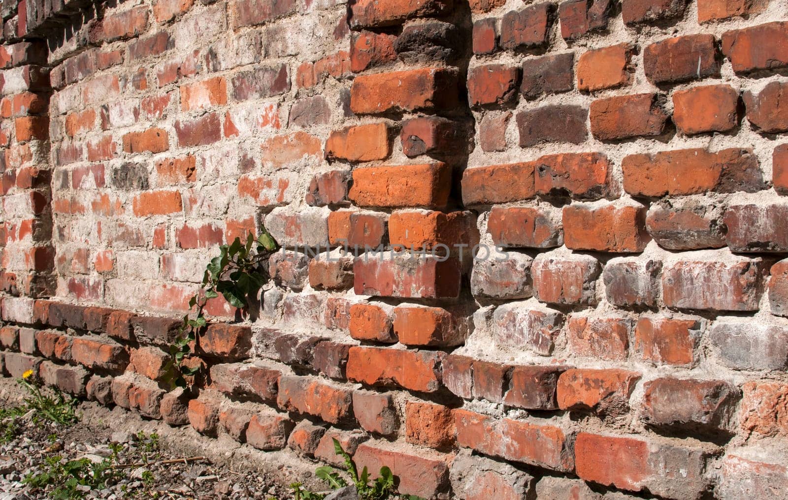 Old weathered grunge brick wall as background